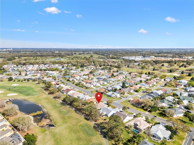 bird's eye view with a residential view, view of golf course, and a water view