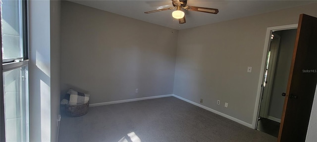 spare room featuring carpet flooring, ceiling fan, and baseboards