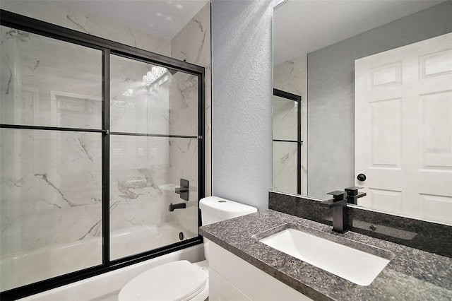 35 Sequoia Loop Ct, Ocklawaha, FL 32179 - bathroom with toilet, vanity, bath / shower combo with glass door, and a textured wall