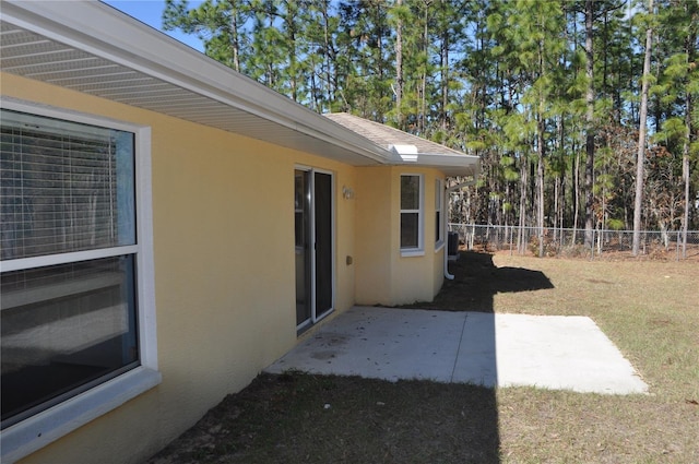 exterior space featuring a patio area and fence