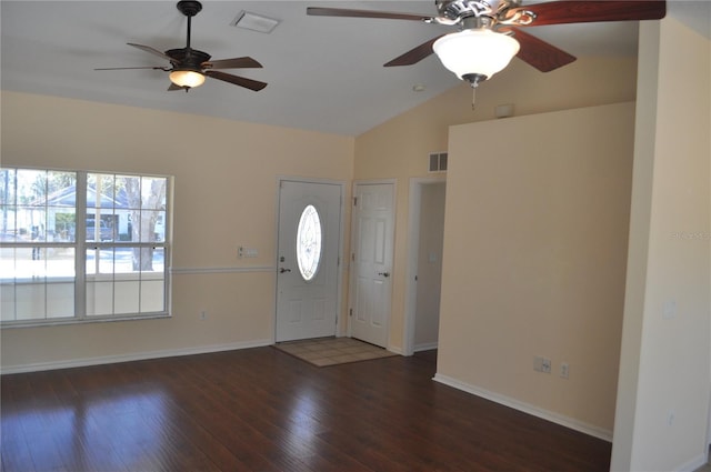 entryway featuring baseboards, visible vents, vaulted ceiling, and dark wood-style flooring