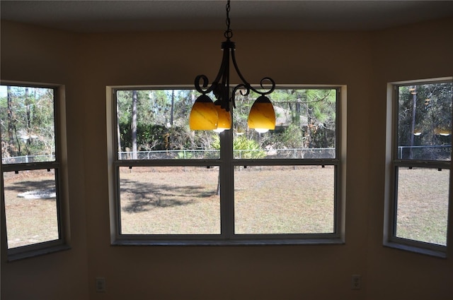 unfurnished dining area with a notable chandelier