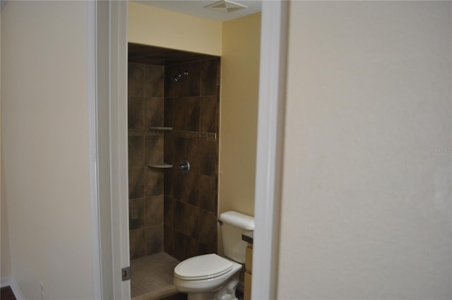 bathroom featuring visible vents, a shower stall, and toilet