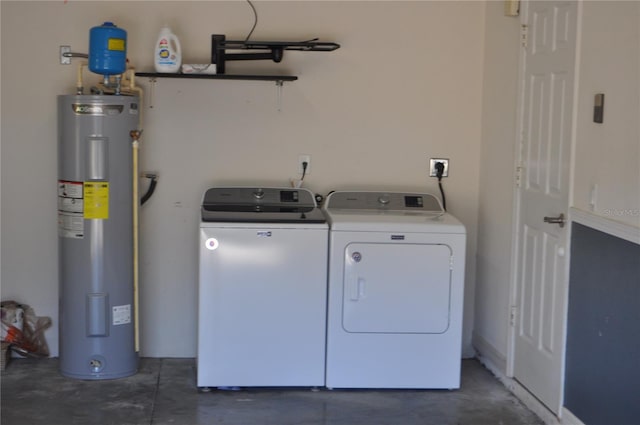 washroom with laundry area, water heater, and independent washer and dryer