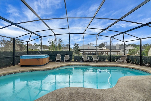 12338 S Putney Ct, Leesburg, FL 34788 - outdoor pool with glass enclosure, a hot tub, and a patio