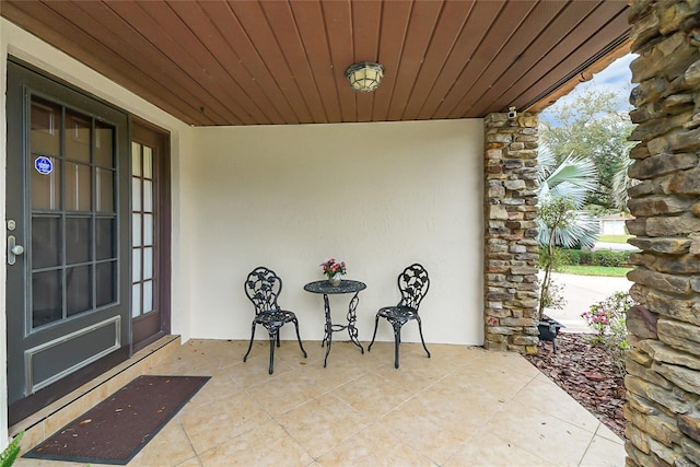 12338 S Putney Ct, Leesburg, FL 34788 - property entrance featuring stone siding and stucco siding