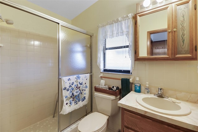 12338 S Putney Ct, Leesburg, FL 34788 - bathroom with tile walls, tasteful backsplash, toilet, a tile shower, and vanity
