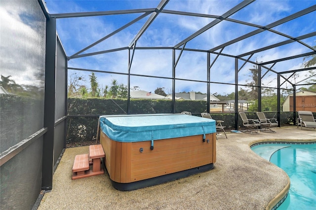 12338 S Putney Ct, Leesburg, FL 34788 - pool with glass enclosure, a patio area, and a hot tub