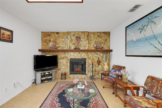 12338 S Putney Ct, Leesburg, FL 34788 - living area with visible vents, a fireplace, a textured ceiling, and baseboards
