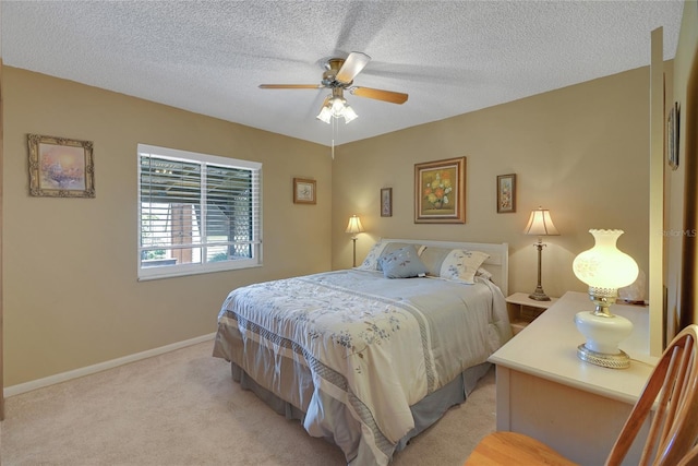 12338 S Putney Ct, Leesburg, FL 34788 - bedroom featuring light carpet, a textured ceiling, a ceiling fan, and baseboards