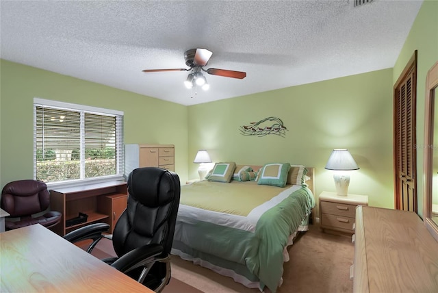 12338 S Putney Ct, Leesburg, FL 34788 - bedroom featuring light carpet, a textured ceiling, a ceiling fan, and a closet