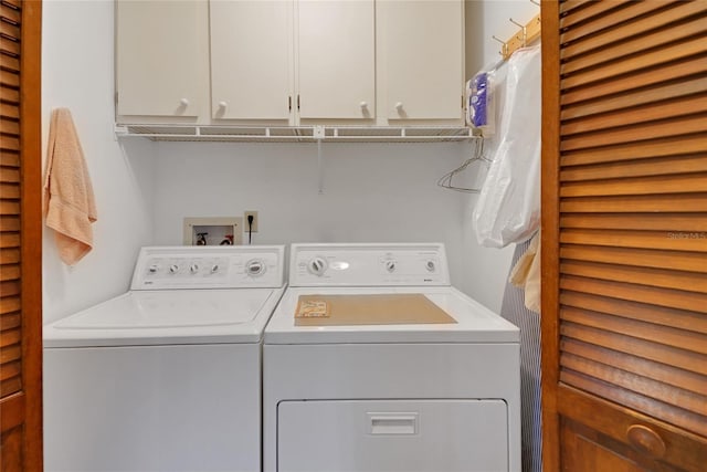 12338 S Putney Ct, Leesburg, FL 34788 - laundry area with washing machine and dryer and cabinet space