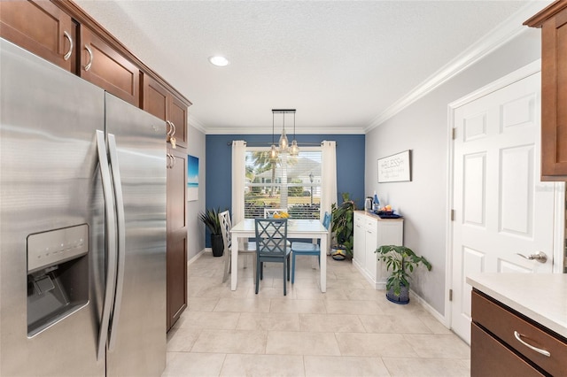 kitchen featuring stainless steel fridge with ice dispenser, ornamental molding, hanging light fixtures, light countertops, and a notable chandelier