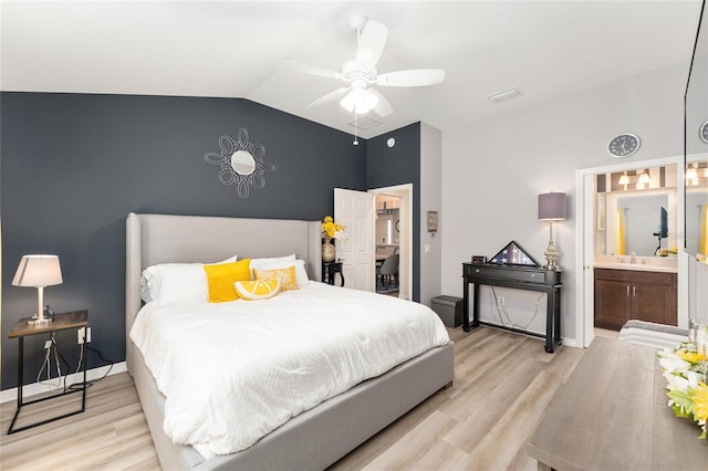 bedroom featuring vaulted ceiling, ceiling fan, light wood-type flooring, and baseboards