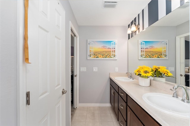 full bath featuring tile patterned flooring, visible vents, a sink, and double vanity