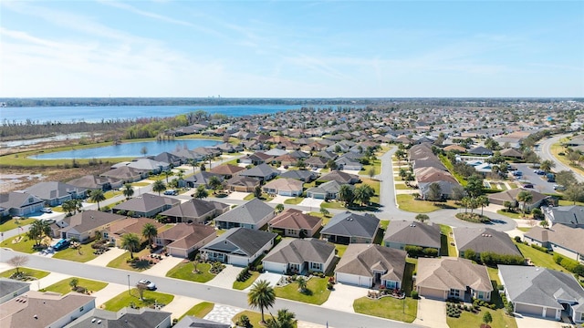 birds eye view of property featuring a residential view and a water view