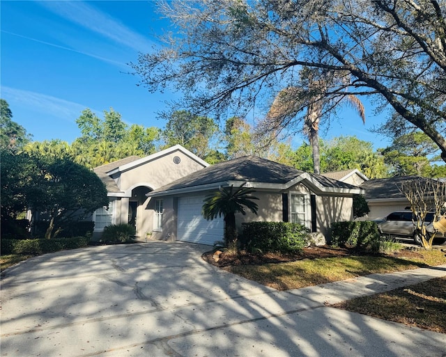 view of front facade with a garage and concrete driveway