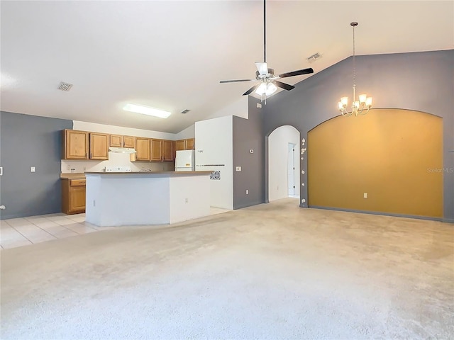 kitchen featuring white fridge with ice dispenser, visible vents, brown cabinetry, and open floor plan