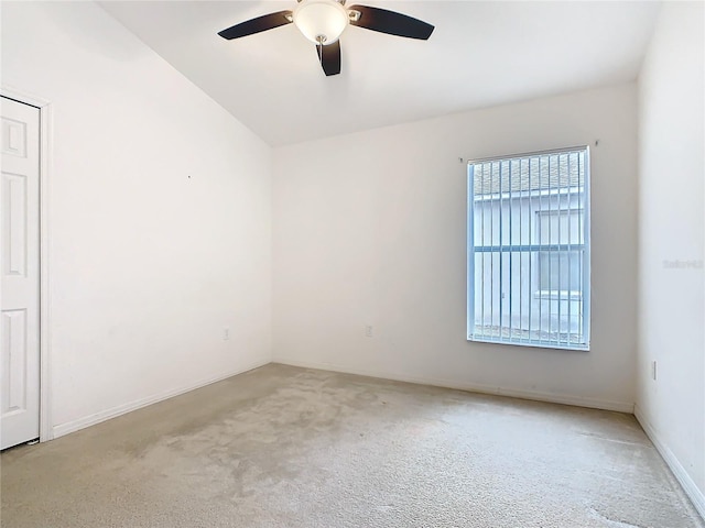 unfurnished room featuring light carpet, ceiling fan, and baseboards