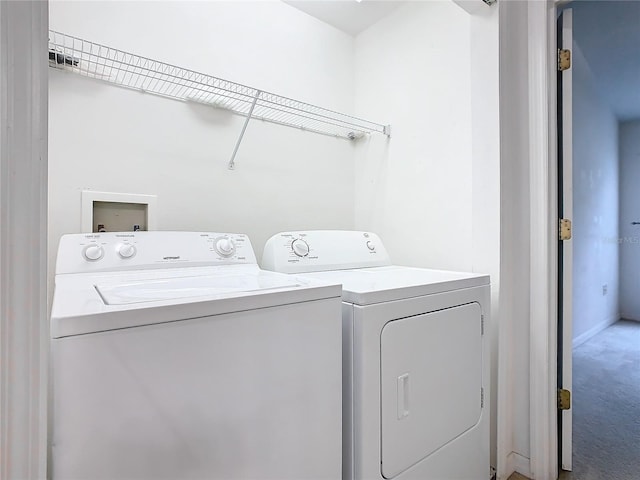 laundry area featuring carpet, laundry area, and washing machine and clothes dryer