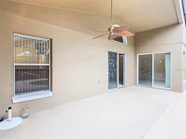 view of patio featuring ceiling fan