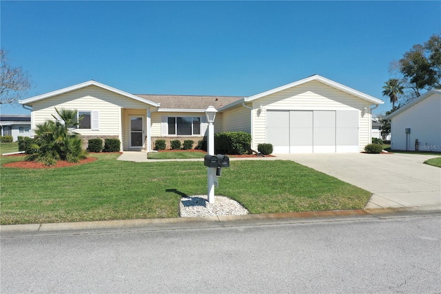 single story home with a front yard, driveway, and an attached garage