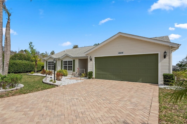 25274 Lost Oak Cir, Leesburg, FL 34748 - single story home featuring decorative driveway and an attached garage