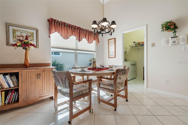 25274 Lost Oak Cir, Leesburg, FL 34748 - dining room with washer / clothes dryer, a notable chandelier, baseboards, and light tile patterned floors
