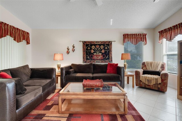 25274 Lost Oak Cir, Leesburg, FL 34748 - living area featuring lofted ceiling, a textured ceiling, and light tile patterned floors