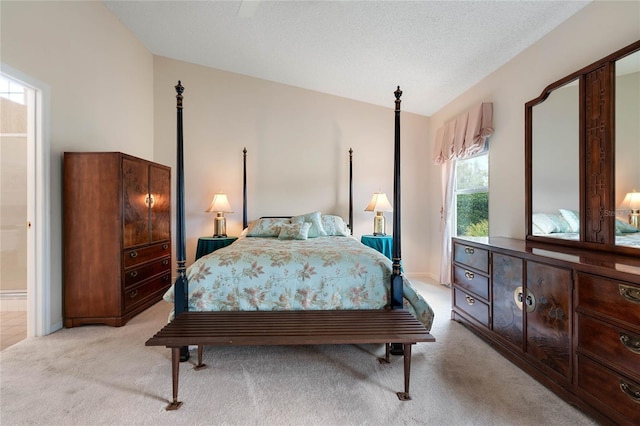 25274 Lost Oak Cir, Leesburg, FL 34748 - bedroom featuring lofted ceiling, light carpet, a textured ceiling, and ensuite bathroom