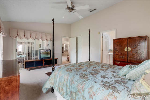 25274 Lost Oak Cir, Leesburg, FL 34748 - bedroom featuring ceiling fan, connected bathroom, light carpet, visible vents, and vaulted ceiling