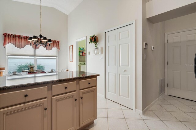 25274 Lost Oak Cir, Leesburg, FL 34748 - kitchen with lofted ceiling, a chandelier, light tile patterned flooring, visible vents, and hanging light fixtures