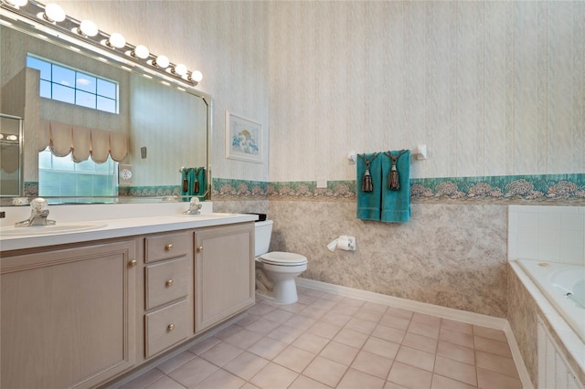 25274 Lost Oak Cir, Leesburg, FL 34748 - full bathroom featuring double vanity, wallpapered walls, tile patterned floors, tiled tub, and a sink
