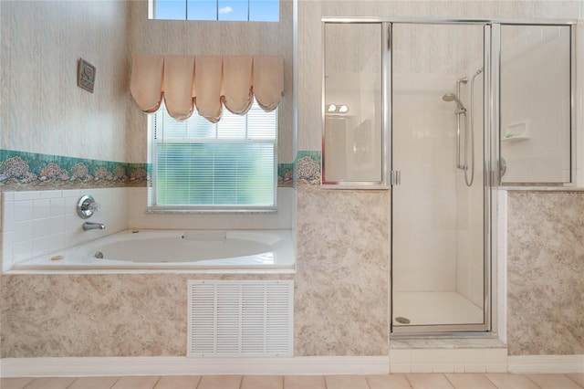 25274 Lost Oak Cir, Leesburg, FL 34748 - full bath with tile patterned floors, visible vents, a stall shower, a bath, and wallpapered walls