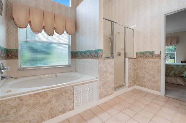 25274 Lost Oak Cir, Leesburg, FL 34748 - ensuite bathroom featuring wallpapered walls, ensuite bath, visible vents, and tile patterned flooring