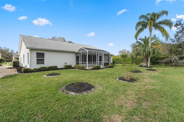 25274 Lost Oak Cir, Leesburg, FL 34748 - rear view of property featuring glass enclosure, cooling unit, and a lawn