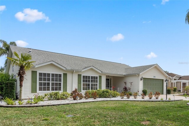 25274 Lost Oak Cir, Leesburg, FL 34748 - ranch-style home featuring a garage, a front lawn, concrete driveway, and roof with shingles