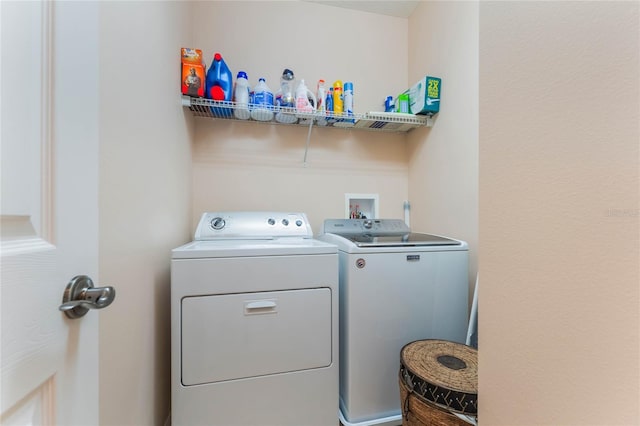 washroom featuring laundry area and washer and clothes dryer