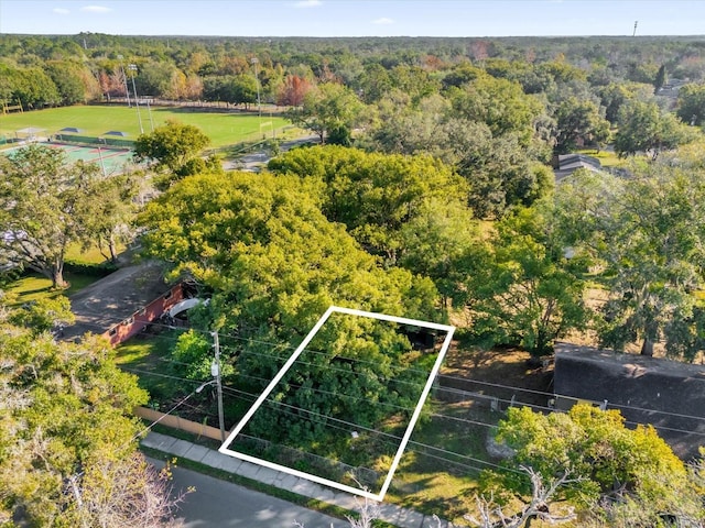 aerial view featuring a wooded view