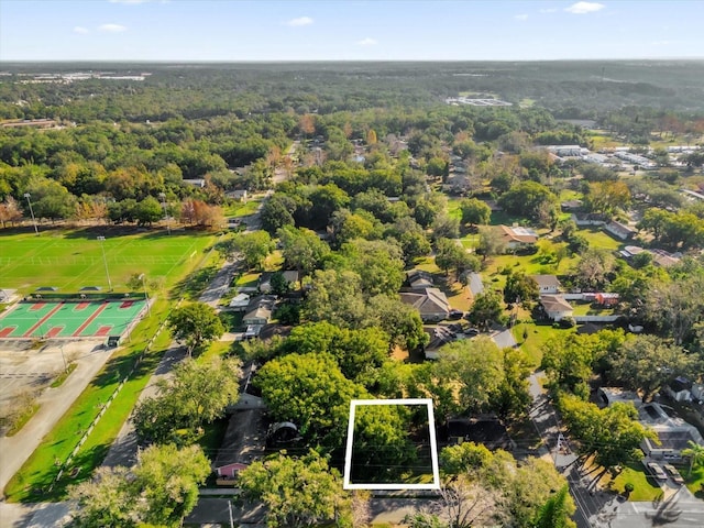 birds eye view of property with a wooded view