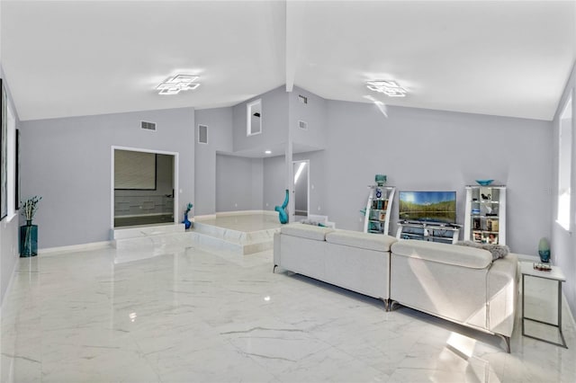 living area featuring beamed ceiling, baseboards, visible vents, and marble finish floor