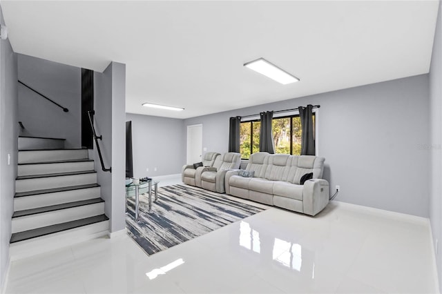 tiled living room with stairway and baseboards