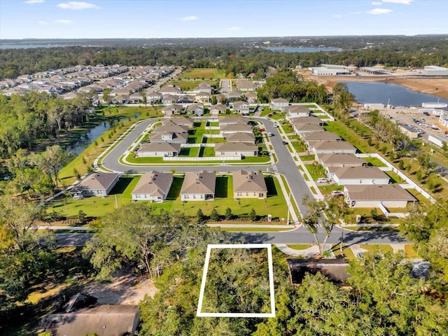 aerial view with a water view and a residential view