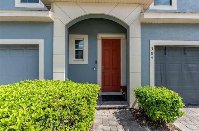 doorway to property with stucco siding