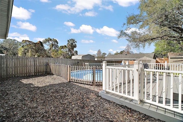 view of swimming pool with a fenced in pool and a fenced backyard