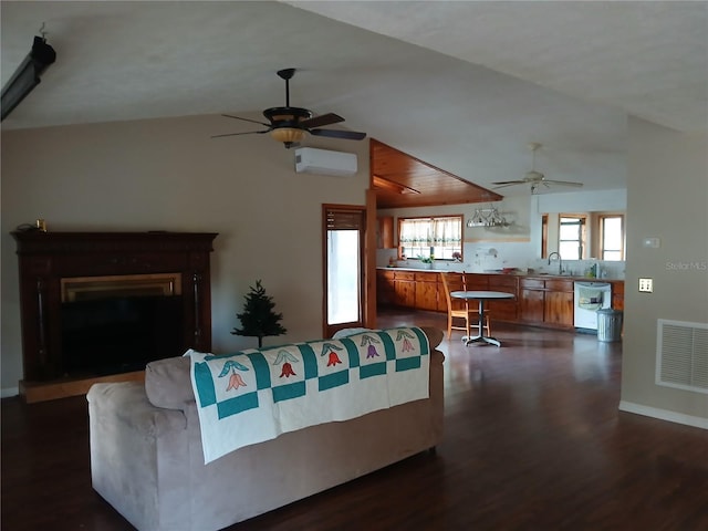 living room featuring lofted ceiling, dark wood-type flooring, visible vents, a ceiling fan, and a wall mounted air conditioner