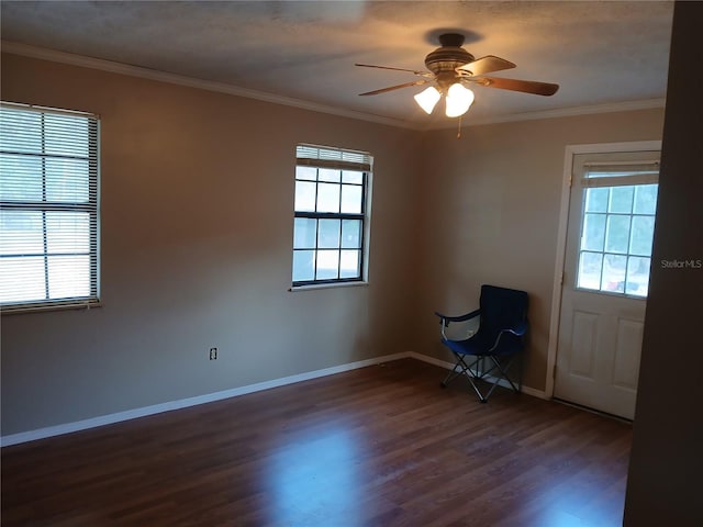 unfurnished room featuring ornamental molding, dark wood finished floors, and a wealth of natural light