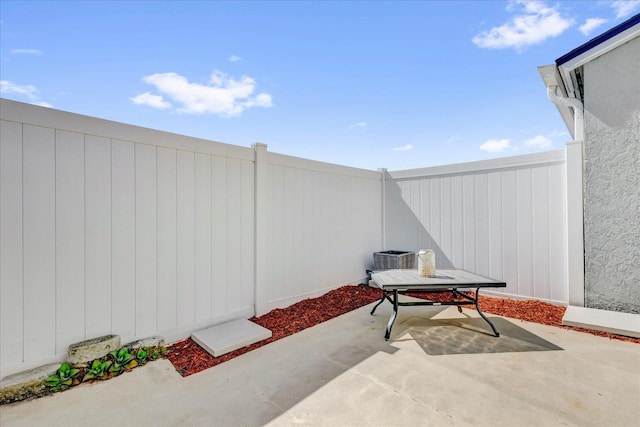 view of patio / terrace with outdoor dining space and a fenced backyard