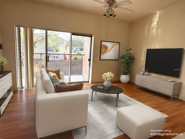 living room featuring ceiling fan and wood finished floors