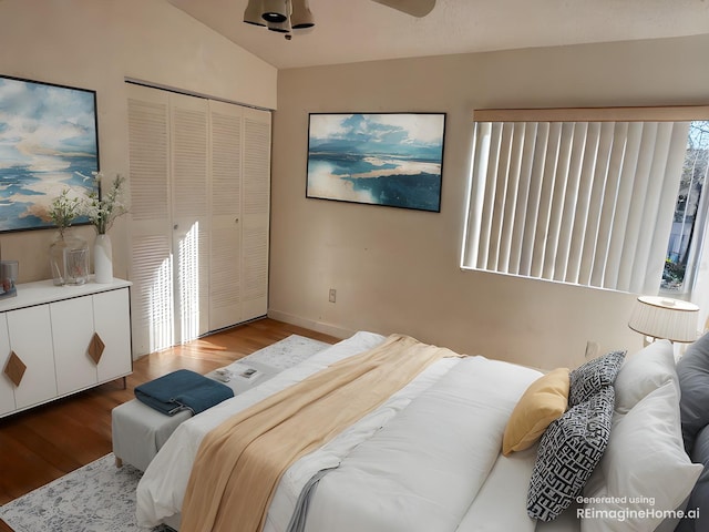 bedroom featuring multiple windows, a closet, and wood finished floors